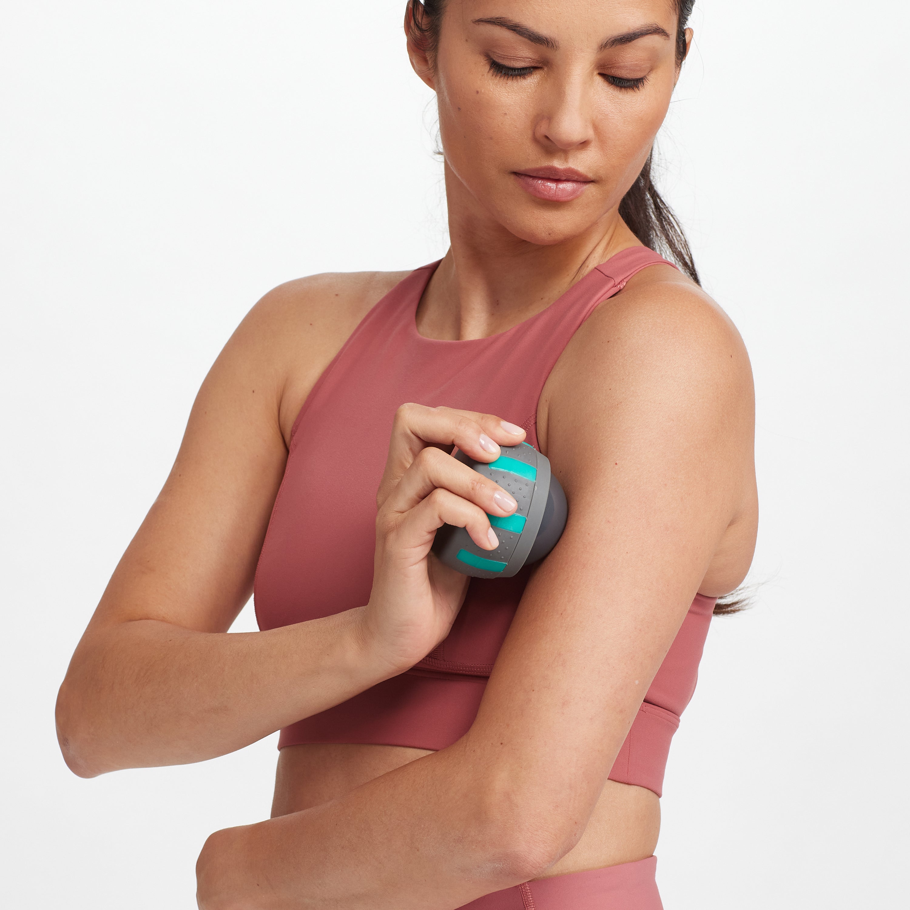 Person using the Sure Grip Massage Roller on the upper arm.